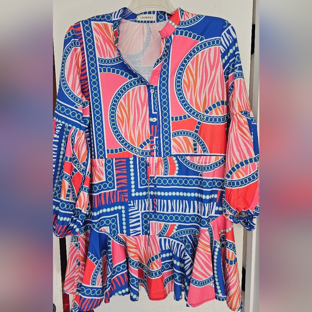 NEWLavender J multicolor babydoll mini dress with a vibrant print, ruffle bottom